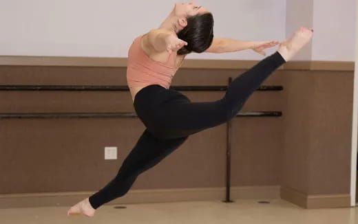 a woman doing a yoga pose