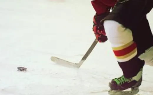 a person is playing hockey