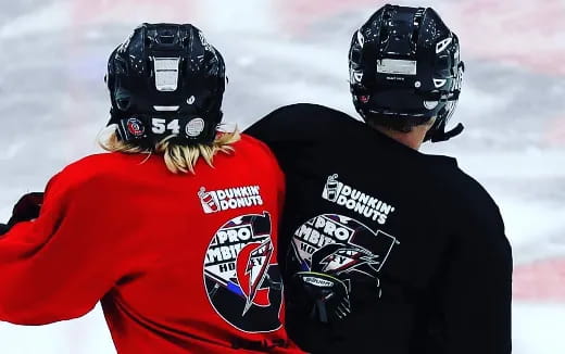 a couple of people wearing helmets