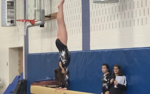 a person doing a handstand on a table