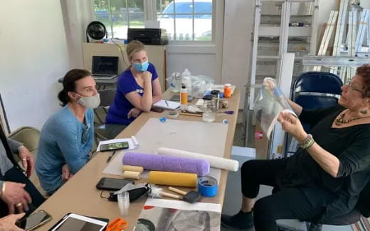 a group of people sitting around a table