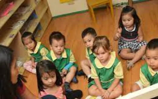 a group of children sitting on the floor