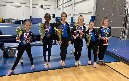 a group of children wearing medals