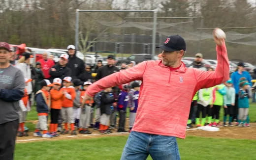 a person throwing a baseball