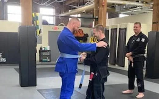 a group of men in martial arts uniforms