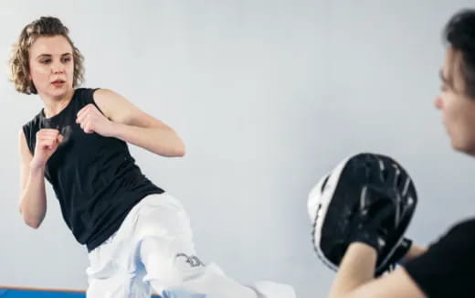 a person kicking another man