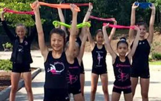 a group of girls holding up their hands