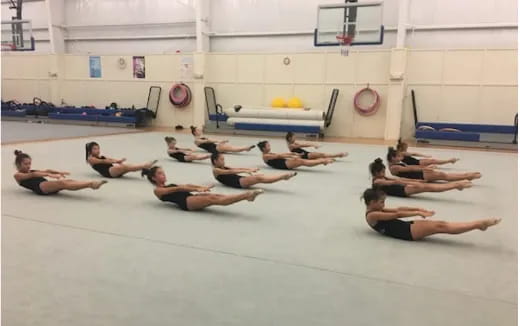 a group of people in a gym