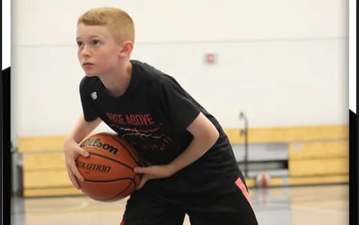 a man holding a basketball