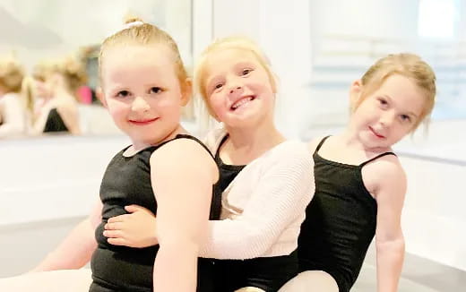 a group of children posing for the camera