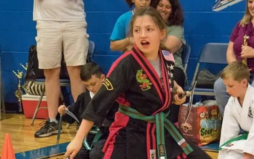 a girl playing a violin