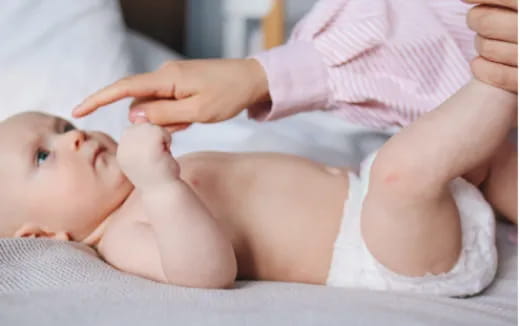 a baby being held by a person