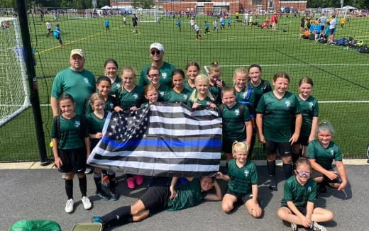 a group of people holding a flag