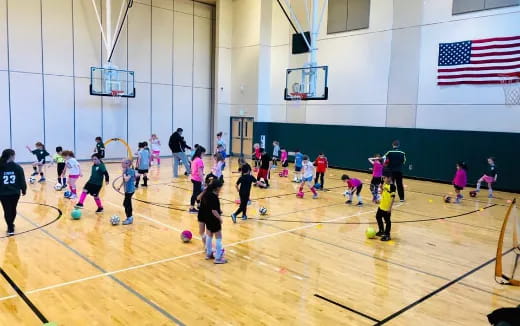 a group of people playing volleyball