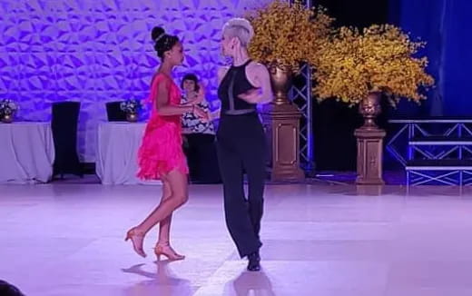 a man and woman dancing