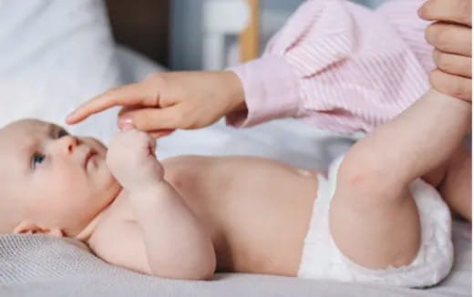 a baby being held by a person