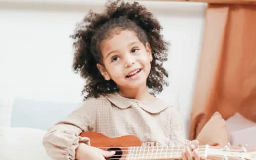 a little girl with curly hair