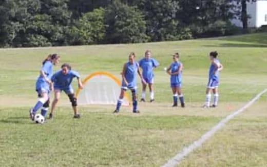 a group of people playing football