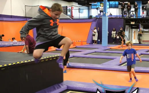 a person jumping over a bar