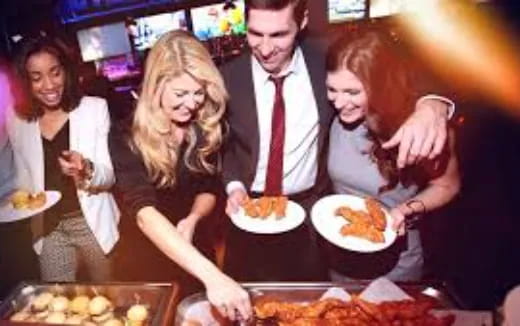 a group of people eating food