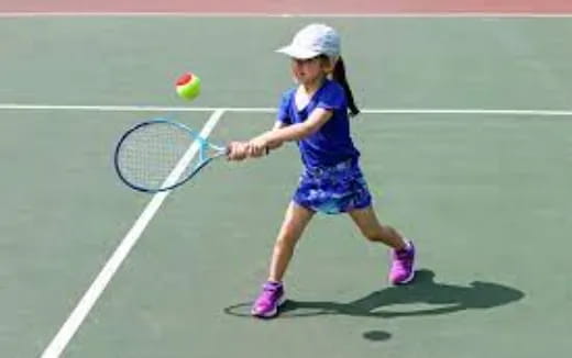 a girl playing tennis