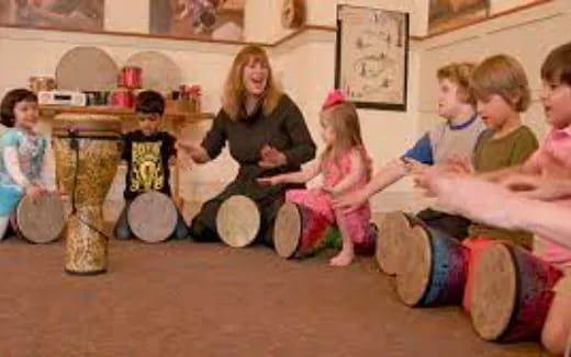 a person and children playing