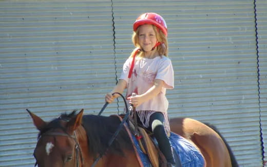 a girl riding a horse