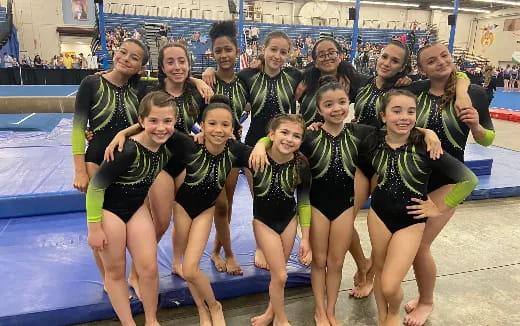 a group of people in swimsuits posing for a photo