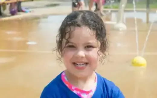 a child smiling at the camera