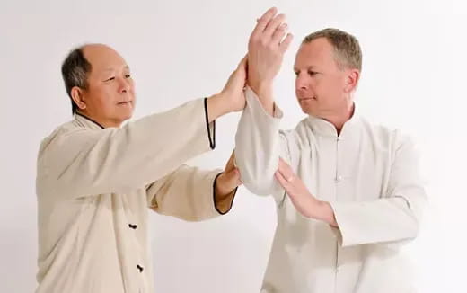 a doctor showing a patient something on the paper