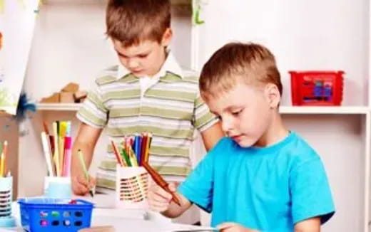 a boy and girl painting