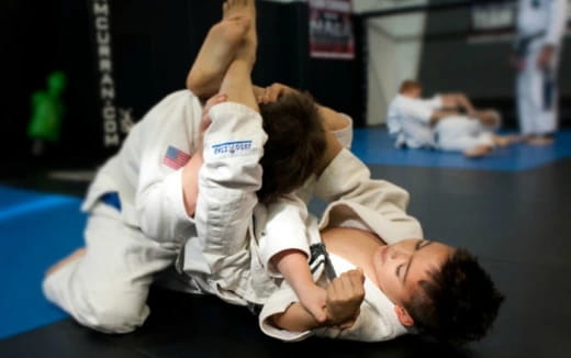 a man and a woman in karate uniforms