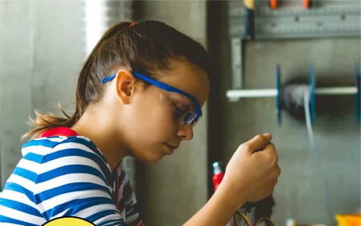 a young girl wearing glasses