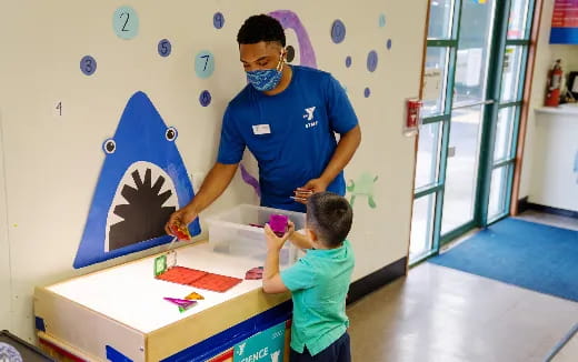 a man and a child wearing masks
