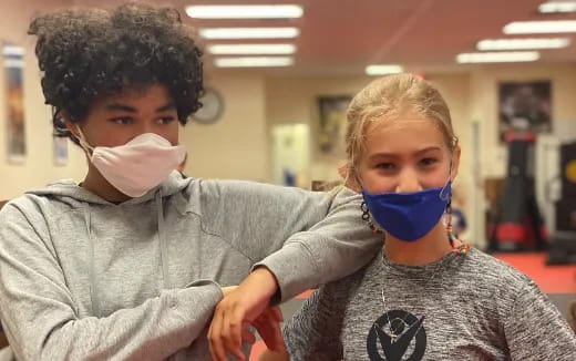 a couple of people wearing masks