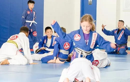 a group of people in karate uniforms