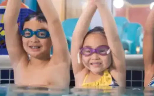 a group of people in a pool