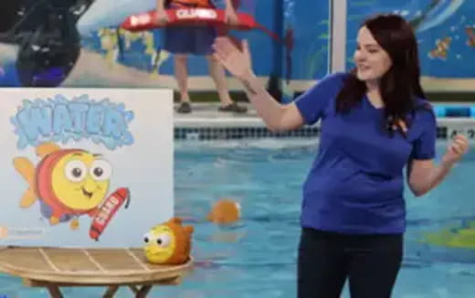 a person standing next to a painting