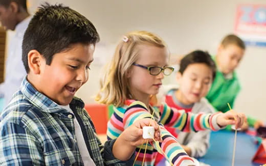 a group of kids playing a video game