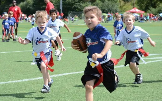 a group of boys playing football