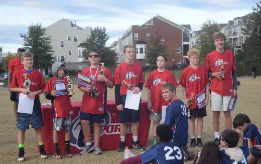 a group of people wearing red shirts