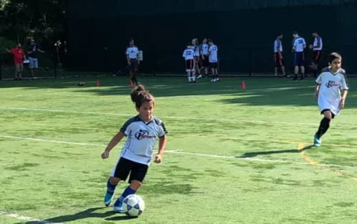 kids playing football on a field