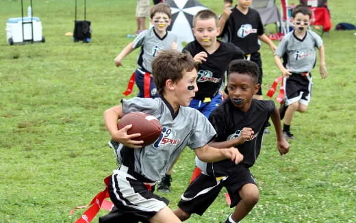 a group of boys playing rugby