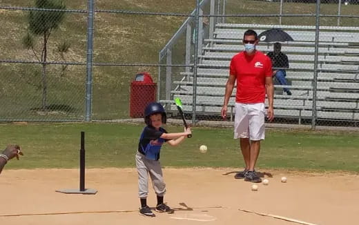 a kid holding a bat