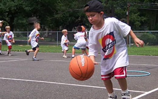 a boy playing basketball