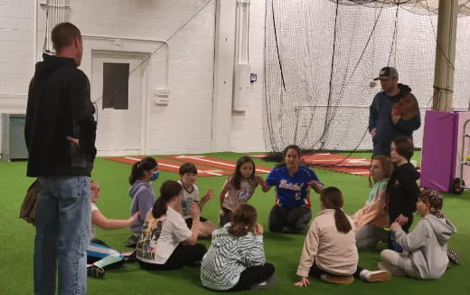 a group of people sitting on the ground