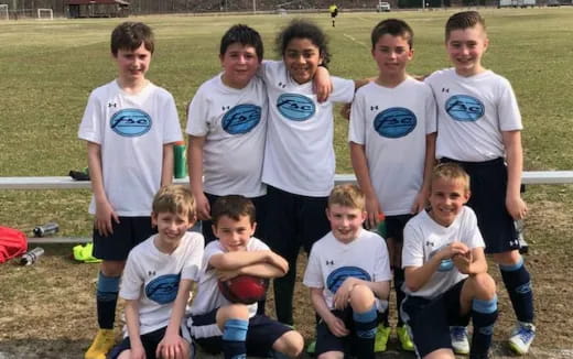 a group of boys posing for a picture