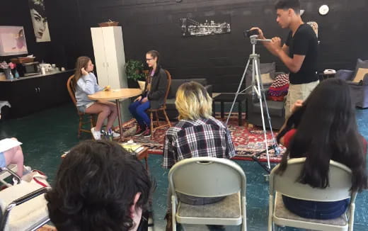 a group of people sitting at tables