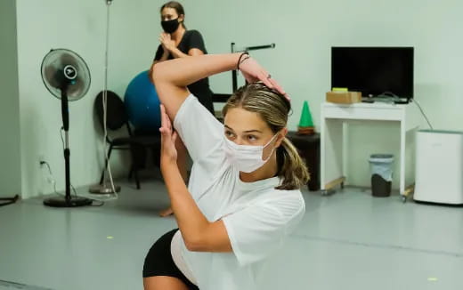 a woman doing yoga in a room