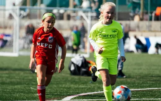 two women playing football